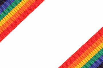 A rainbow belt or ribbon is an LGBTQ symbol on a white background.The boundaries of the pride of the gay and lesbian community, the design of leaflets,greeting cards.Space for text