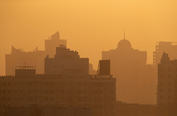 Silhouette of buildings during Sunrise, a view from Tubli bay, Bahrain