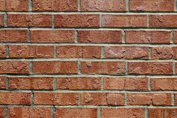 Obraz premium A close view of the red brick surface textures.