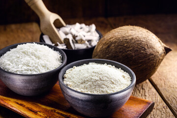 organic coconut flour, with grated coconut in the background, culinary ingredients for fruit sweets