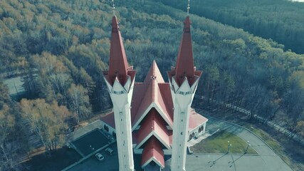 The Tulip Mosque. Ufa sight. A beautiful temple. Red roof. An architectural monument in the forest. Flying over the mosque.