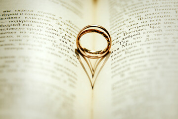 Fototapeta premium rings on book