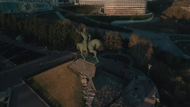 Monument to Salavat Yulaev in Ufa. Rider hero. National hero. Monument at the top of the mountain. Monument in the rays of the setting sun. Beautiful sunset in the park. The beauty of Russia.