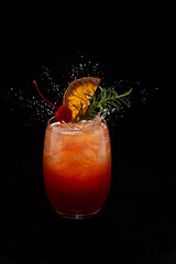 Sex on the beach cocktail in glass on black background