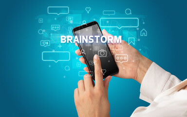 Hand using smartphone with social media concept