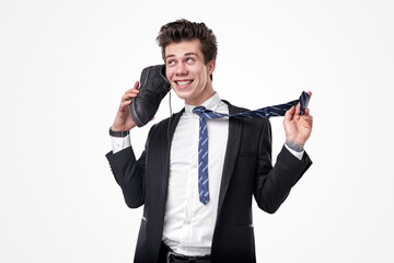 Crazy businessman using shoe as phone