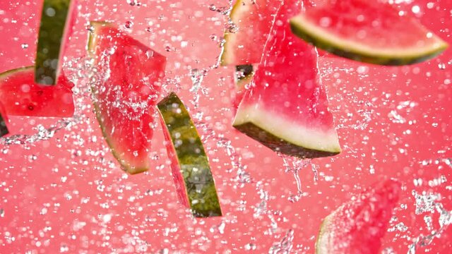 Super Slow Motion Shot of Flying Fresh Melon Cuts and Water Side Splash at 1000 fps.