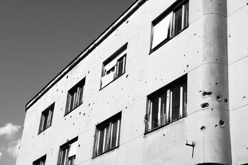 Houses in Mostar in Bosnia-Herzegovina, with holes in the walls, caused by the conflict
