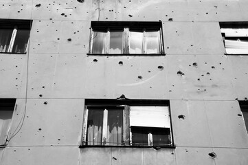 Houses in Mostar in Bosnia-Herzegovina, with holes in the walls, caused by the conflict