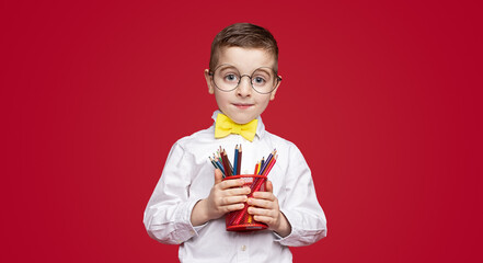 Smart little student with stationery