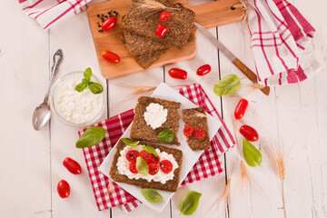
Rye bread with cottage cheese, basil and tomato.

