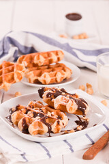Waffles with chocolate cream and hazelnuts.