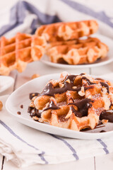 Waffles with chocolate cream and hazelnuts.