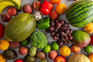 bulk fruits and vegetables. Piel de sapo melon, green broccoli, red watermelon, red grapes, limes,...