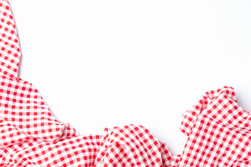 Top view fabric red and white checkered isolated on a white background with copy space. Cloth cotton tablecloth for menu food restaurants.