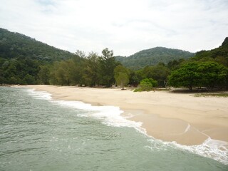 Beautiful view of the beach with blue sky and the trees