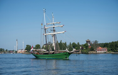 Green two mast sail boat leaving Stockholm for the archipelago