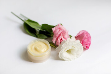 Cream in a jar on a white background