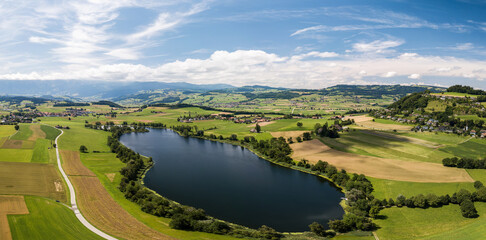 Fototapeta na wymiar Aerial panorama image of Gerzensee lake in Bern Oberland, Switzerland