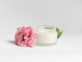 Cream in a jar on a white background