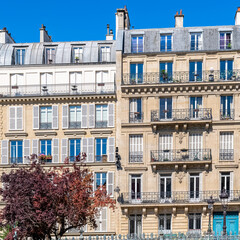 Fototapeta premium Paris, typical facade, beautiful building with old zinc roofs, rue Fenelon 