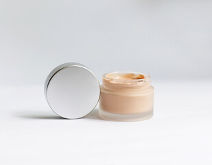Cream in a jar on a white background