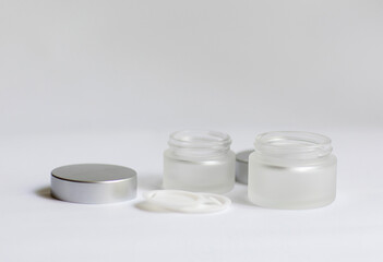 jar of cream on a white background