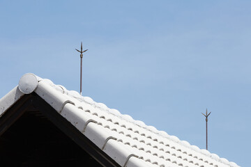 Air terminal rod or Lightning rod on the roof of a building for lightning protection systems and protect electrical equipment damage when raining and lightning strike. - obrazy, fototapety, plakaty
