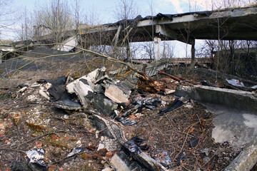 Destroyed abandoned building ruins. Farm hangar destroyed by weather after economic crisis.