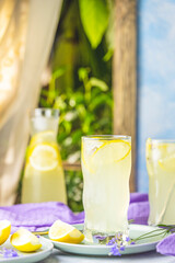 Glasses of lavender lemonade with cube ice with lavender flowers