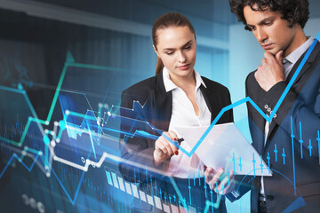 Businessman and businesswoman looking into notes. Stock market g