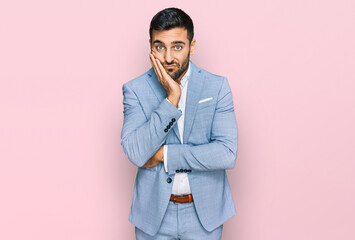 Young hispanic man wearing business jacket thinking looking tired and bored with depression...