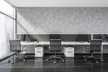 Three workplaces in the grey panoramic office
