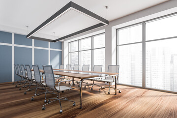 Corner view of modern meeting room with striped blue wall