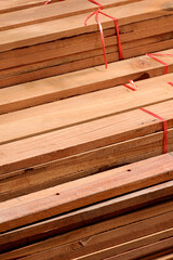 High angle view of wooden planks stack in vertical frame, construction material background