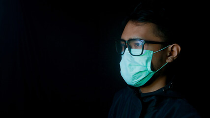 Asian man wearing protective mask isolated over background