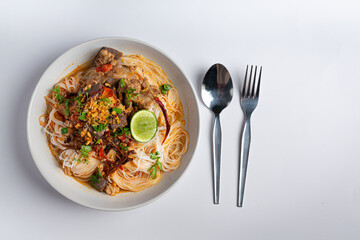 Rice noodles in fish curry sauce with vegetables