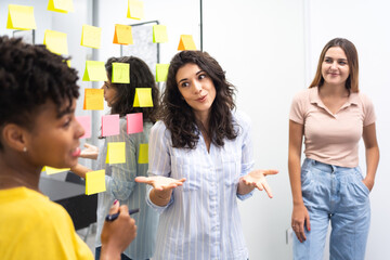 Group Of Coworkers Talking During Meeting