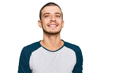 Hispanic young man wearing casual clothes looking positive and happy standing and smiling with a confident smile showing teeth