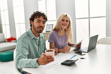 Fototapeta premium Young couple controlling family economy at home.