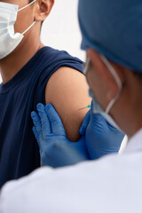 Closed shot of a doctor vaccinating Latino people. Vaccination campaign in Latin America