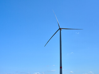 One wind power generator set against blue sky