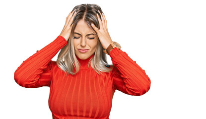 Beautiful blonde woman wearing casual clothes suffering from headache desperate and stressed because pain and migraine. hands on head.