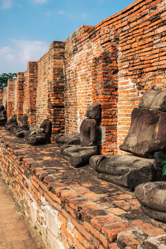 Buddha statues and ancient ruins of Buddhist temples in Ayutthaya, Thailand