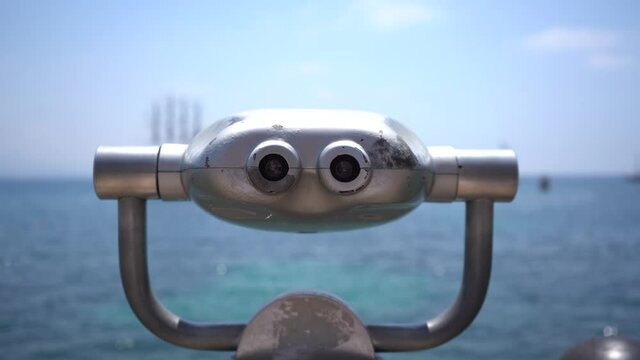 Close up of Tower viewer against a clear blue sky and a blue sea. Points for observation by tourists. City binocular is a popular place for tourists.