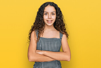 Teenager hispanic girl wearing casual clothes happy face smiling with crossed arms looking at the camera. positive person.