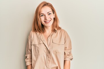 Young caucasian woman wearing casual clothes with a happy and cool smile on face. lucky person.