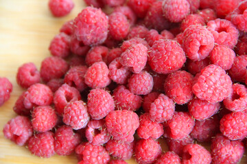 fresh raspberries on a white background close-up