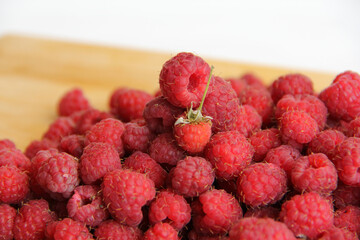 fresh raspberries on a white background close-up
