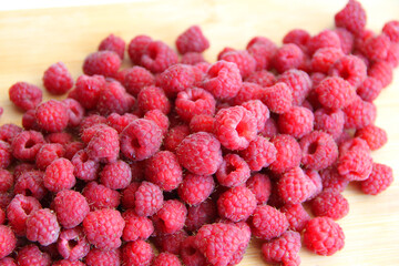 fresh raspberries on a white background close-up